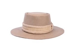 Hat made of the finest camel tan wool with a hand elaborated bow composed of jute fiber trim, back side view