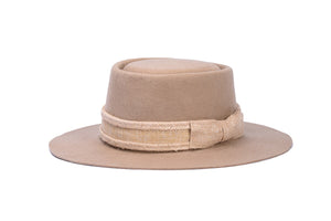 Hat made of the finest camel tan wool with a hand elaborated bow composed of jute fiber trim, right side view