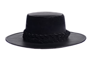 Hat swathed in rich black velour fabric and a brim made of black synthetic leather with a double braid velour trim, front view